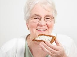 Elder lady with great smile and breakfast