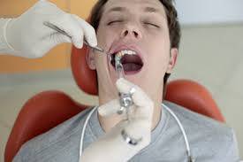 Man receiving dental anesthesia before extraction