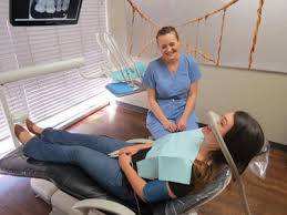 Woman receiving sedation before dental procedure