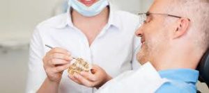 Patient learning how dental implants work